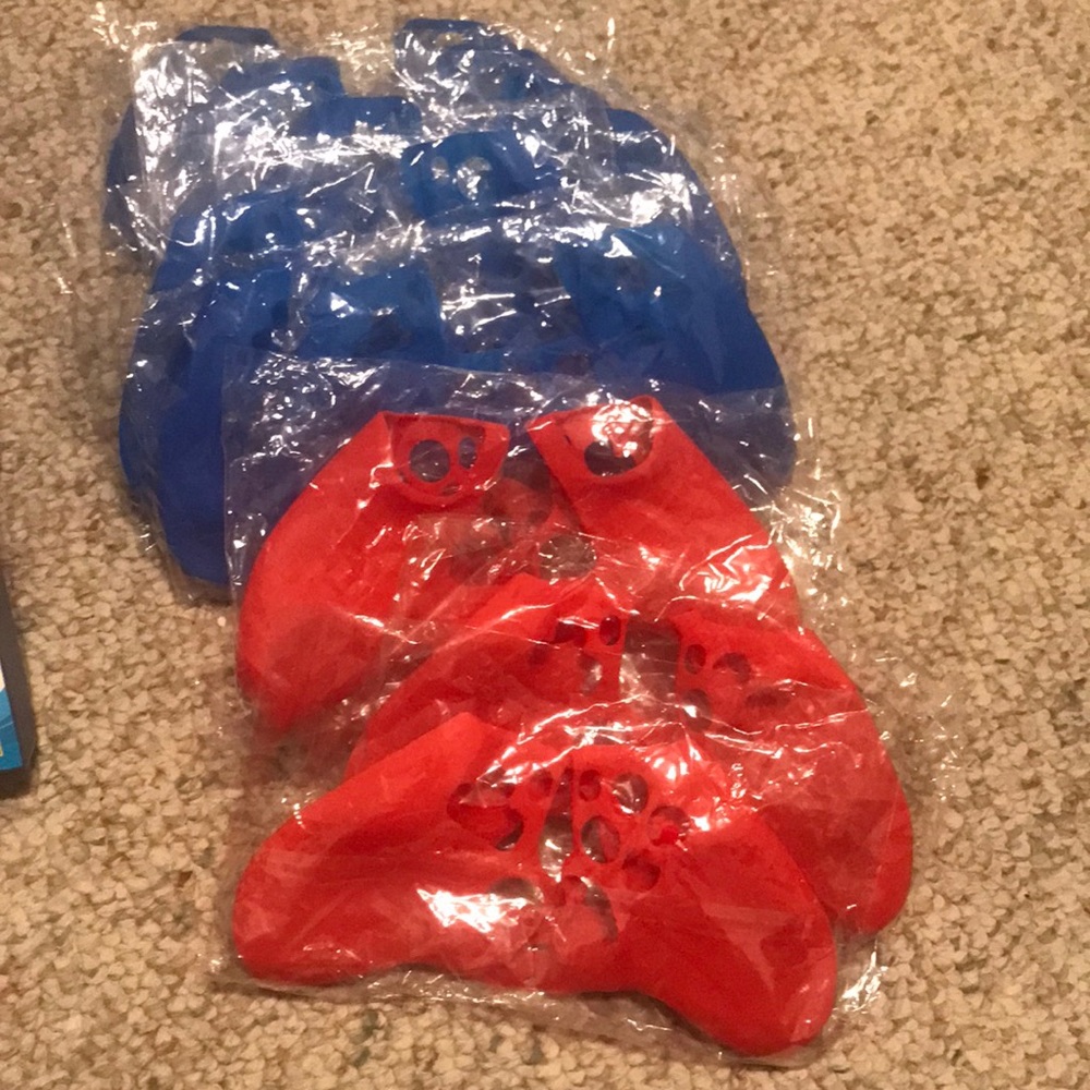 Lot of PS5 controller covers (12) 4 red 8 blue